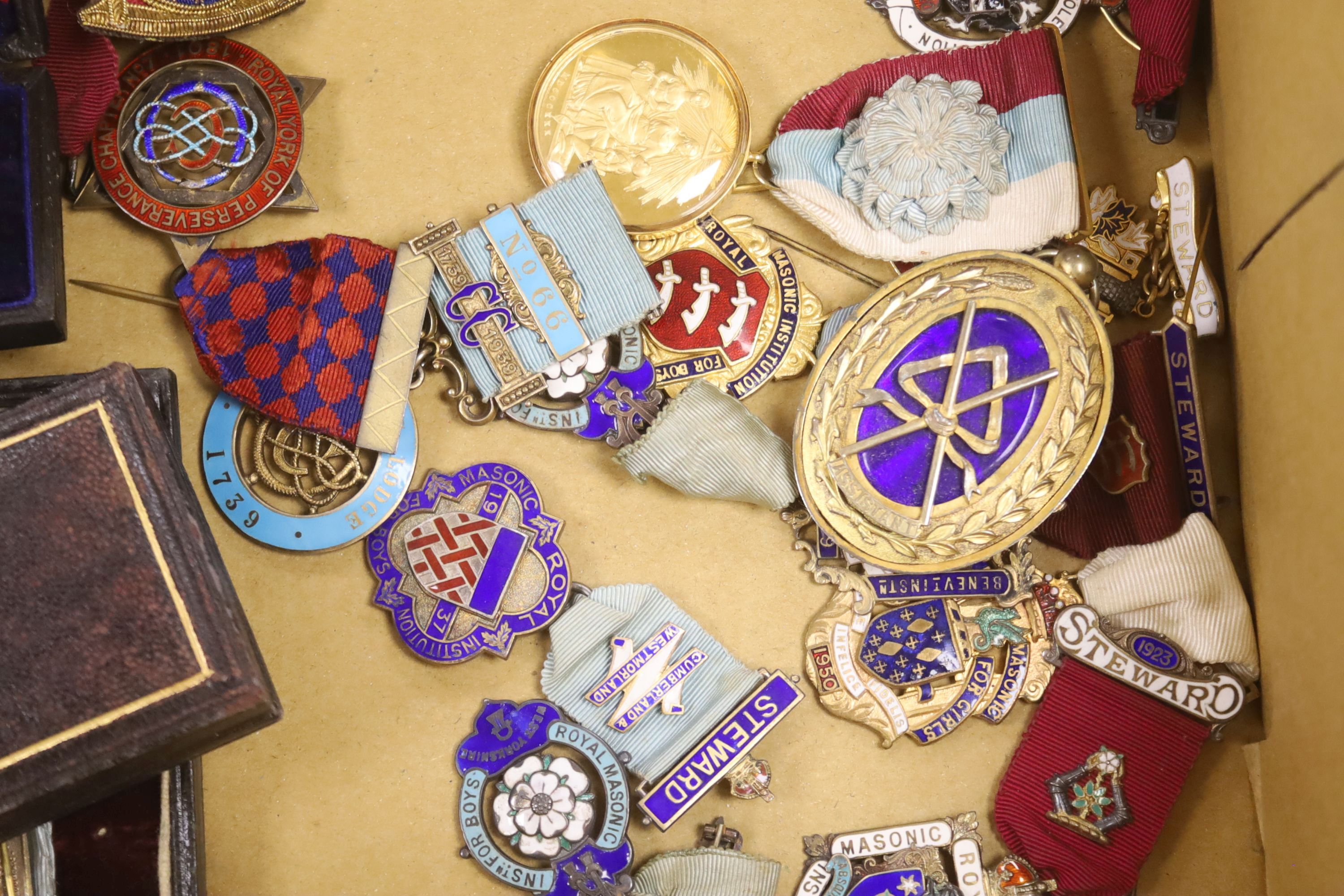 Twenty two silver gilt and enamelled Masonic medallions